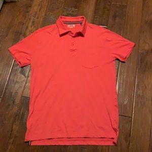 Charleston threads polo. Orange/red color